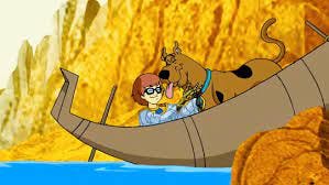 Scooby licks Velma in a boat when they discover she’s the villain (Scooby-Doo! In Where’s My Mummy, 2005) Scooby licks Velma in a boat when they discover she’s the villain (Scooby-Doo! In Where’s My Mummy, 2005)