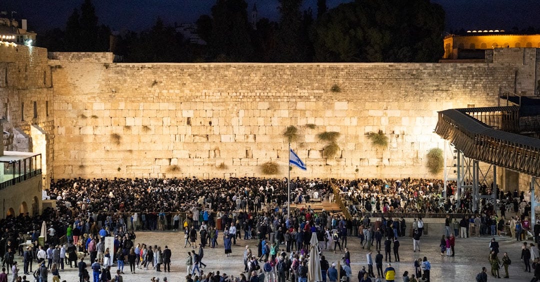 people gathered near pole