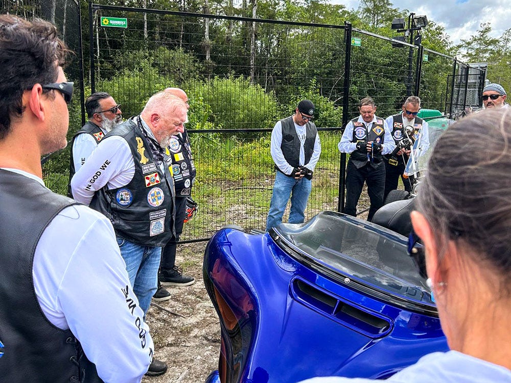 Archbishop Thomas Wenski of Miami and Knights on Bikes pray the rosary for detainees at the entrance to Alligator Alcatraz, a controversial immigration detention facility some 55 miles from Miami in the Florida Everglades, July 20, 2025. (OSV News/Thomas G. Wenski) Archbishop Thomas Wenski of Miami and Knights on Bikes pray the rosary for detainees at the entrance to Alligator Alcatraz, a controversial immigration detention facility some 55 miles from Miami in the Florida Everglades, July 20, 2025. (OSV News/Thomas G. Wenski)