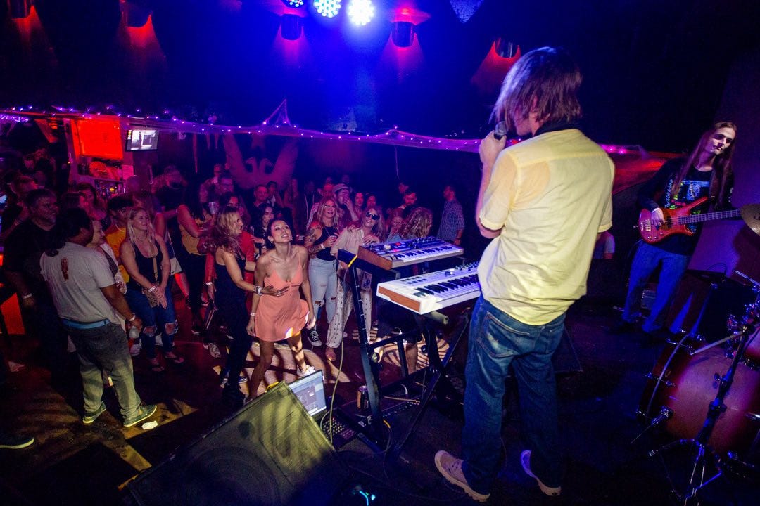 May be an image of saxophone and crowd May be an image of saxophone and crowd