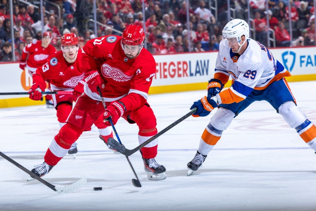 Brock Nelson looks to take the puck away from Dylan Larkin during the Islanders' loss. Brock Nelson looks to take the puck away from Dylan Larkin during the Islanders' loss.