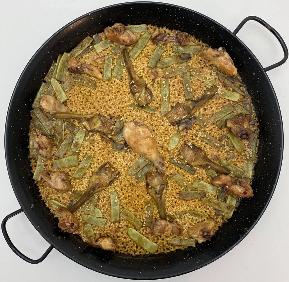 A pan of food with chicken legs and beans
AI-generated content may be incorrect. A pan of food with chicken legs and beans
AI-generated content may be incorrect.