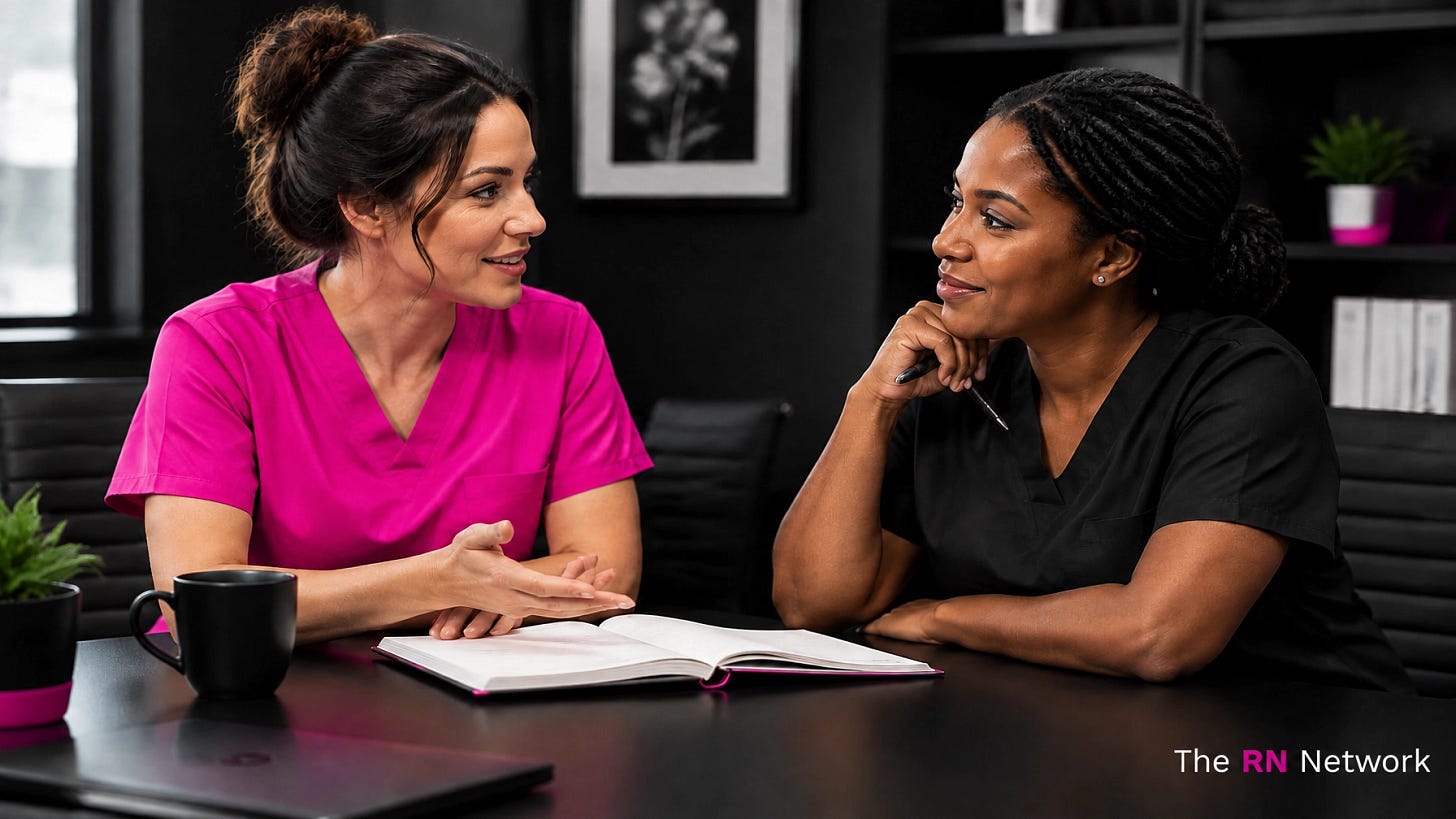Two nurses in pink and black scrubs having a private professional conversation Two nurses in pink and black scrubs having a private professional conversation