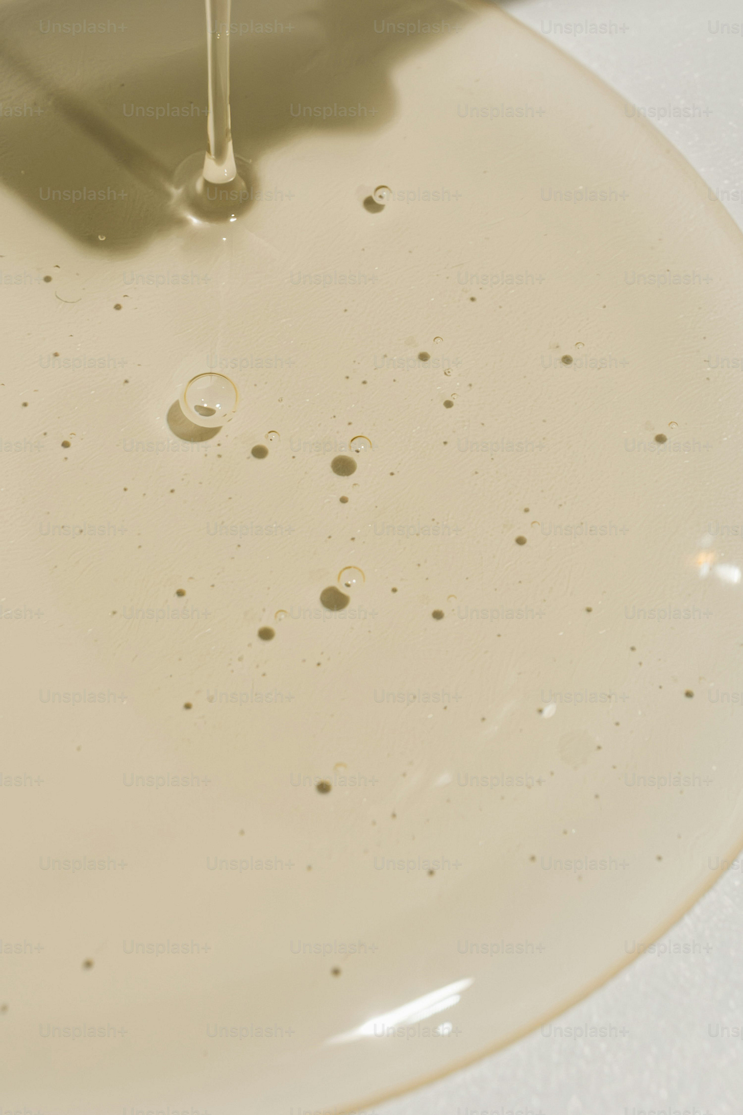 a close up of a sink with a faucet running