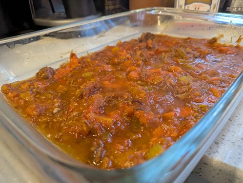 Assembling bottom layers of lasagna.