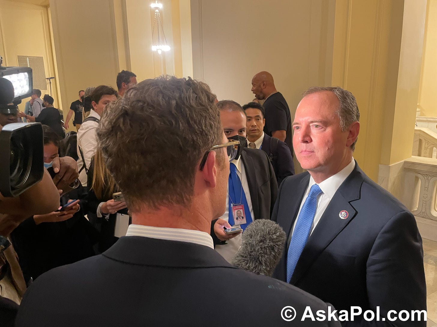 A senator listens to a TV reporter ask him questions. Photo: Matt Laslo © www.askapol.com