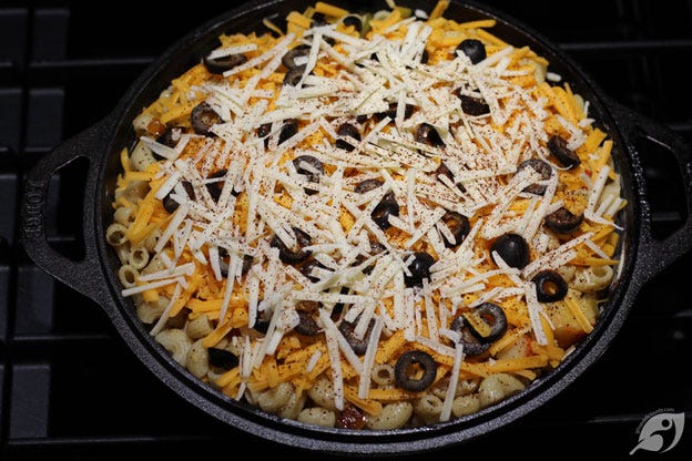 After adding the second layer of the lobster and macaroni mixture, cover using the rest of the grated Colby cheese. Top with the sliced black olives and the grated Asiago cheese. Sprinkle the chili powder over the top. After adding the second layer of the lobster and macaroni mixture, cover using the rest of the grated Colby cheese. Top with the sliced black olives and the grated Asiago cheese. Sprinkle the chili powder over the top.