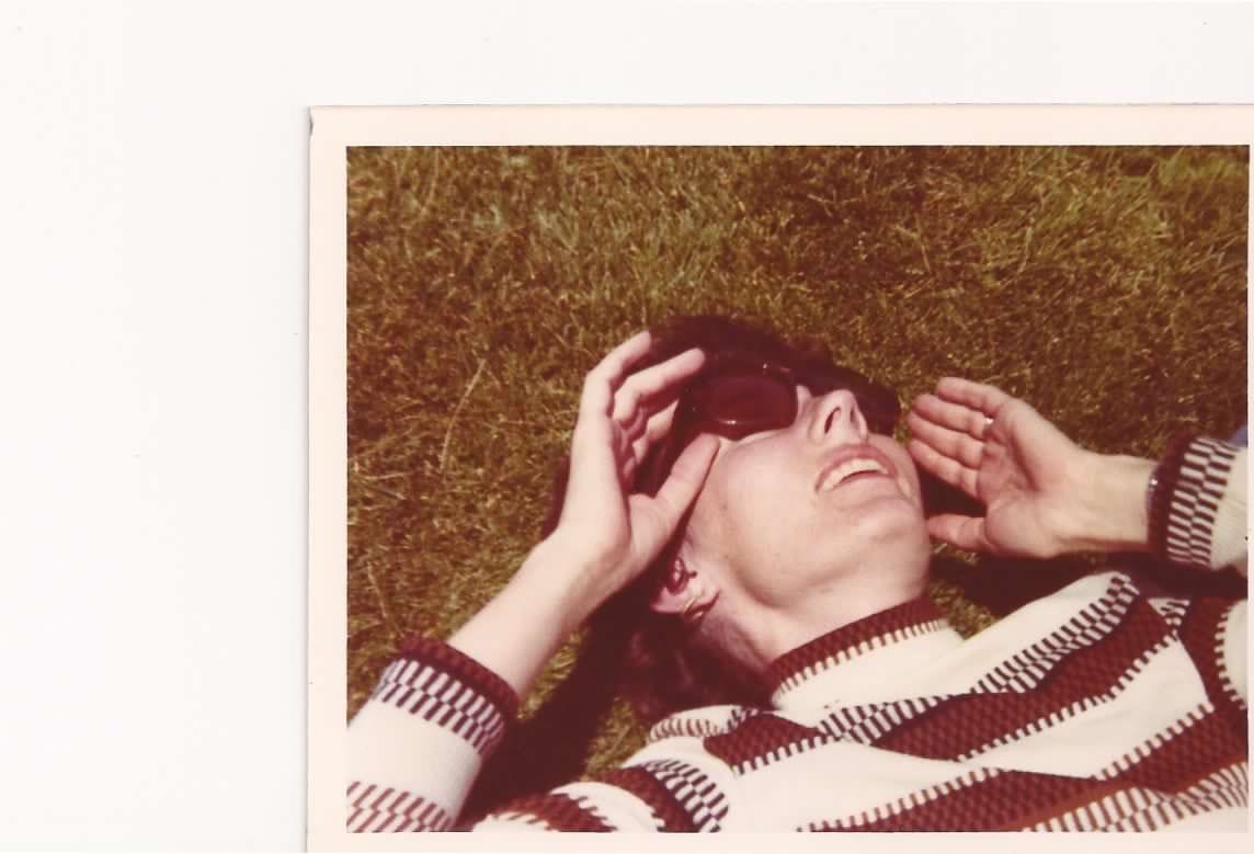 Women laying on the grass in a vintage print photograph Women laying on the grass in a vintage print photograph