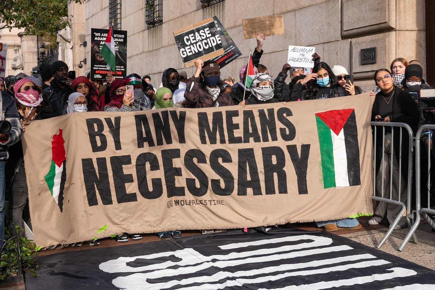 A group of people holding a banner

Description automatically generated