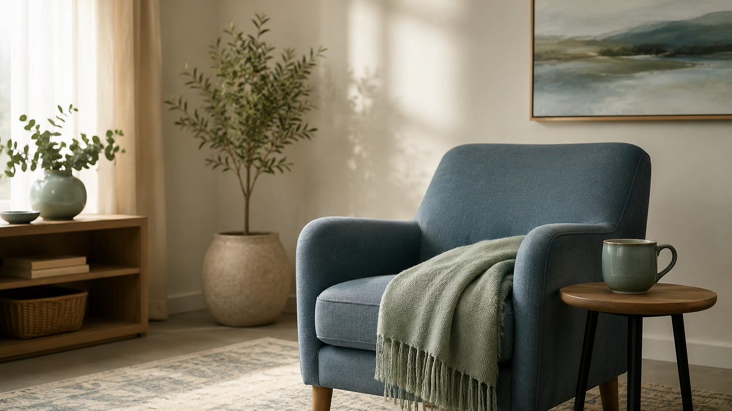 Calm therapeutic room with a folded blanket and soft light, representing emotional safety and pacing.