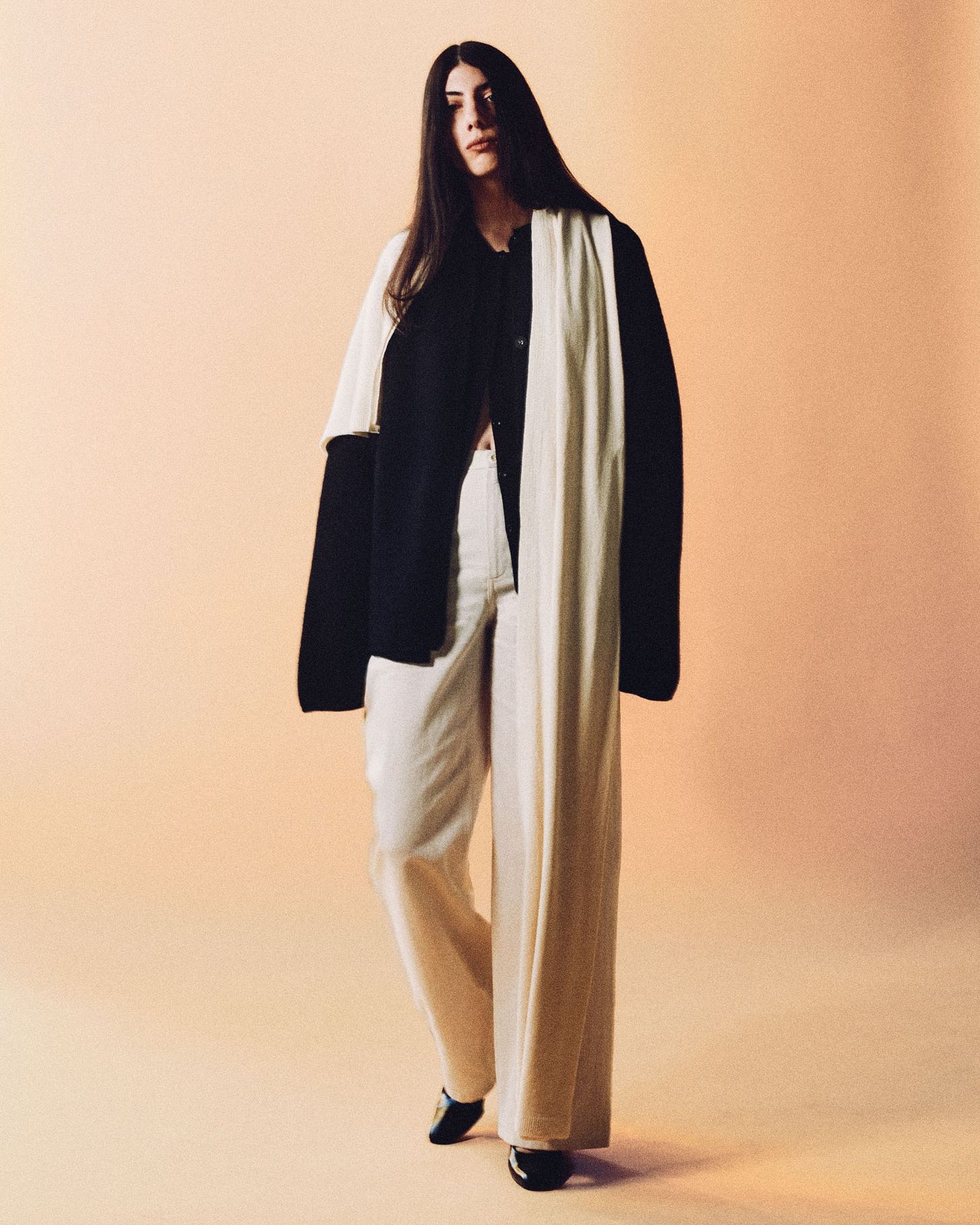 Image may contain Anne Bedian Clothing Coat Fashion Cape Formal Wear Suit Adult and Person