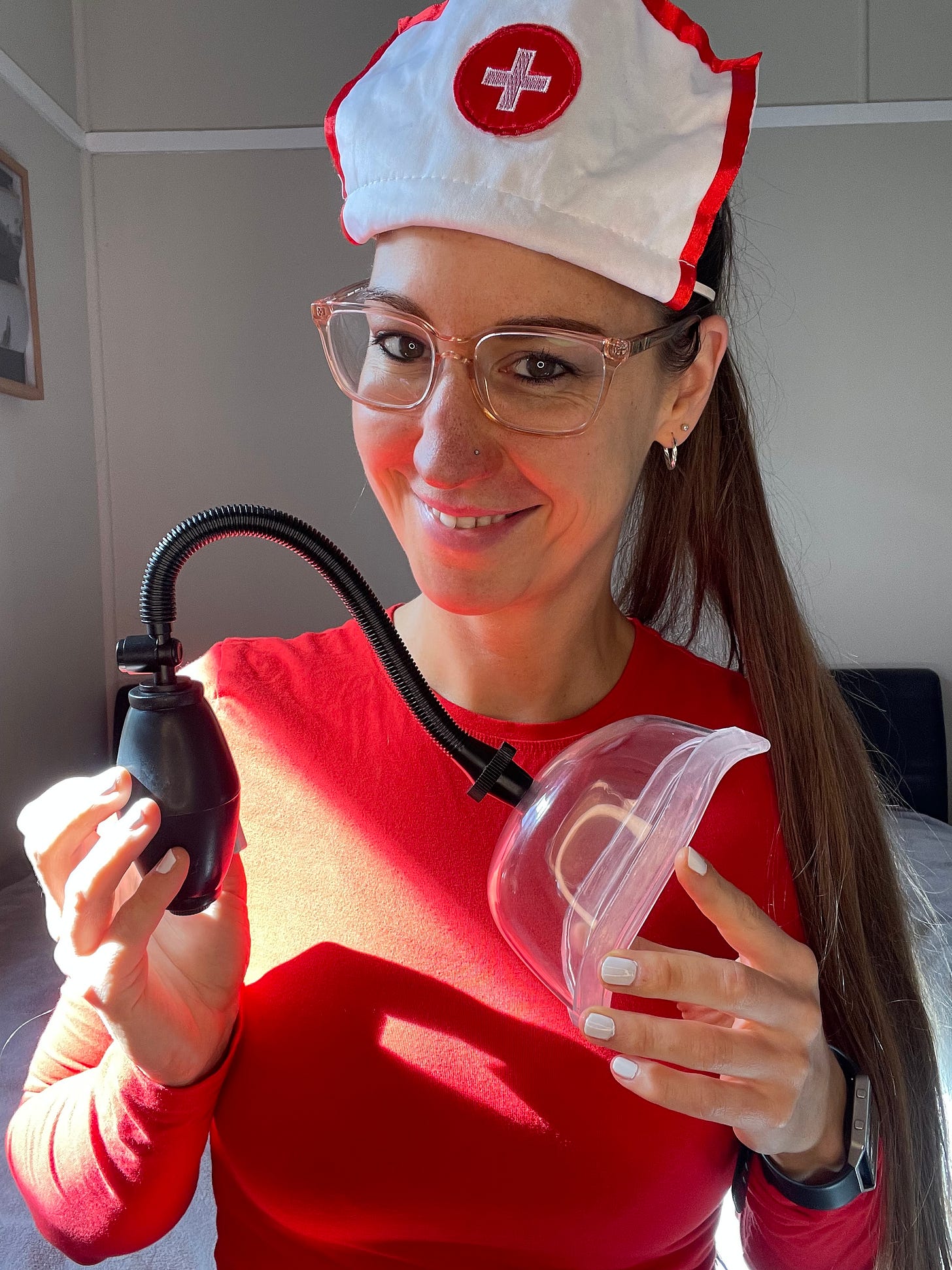 Pleasurelit Patricia holding a vulva pump