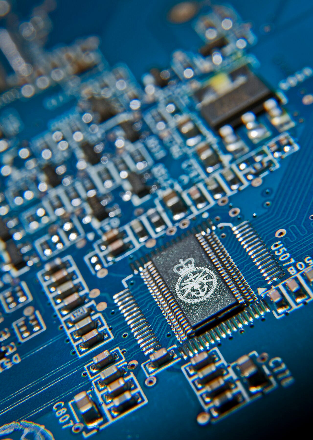 The Ministry of Defence badge on a computer chip. Britain will build a dedicated capability to counter-attack in cyberspace and, if necessary, to strike in cyberspace. As part of MOD’s full-spectrum military capability, the Defence Secretary, Philip 