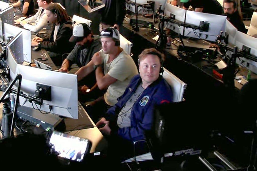 Elon Musk reacts to the test flight explosion on Thursday.