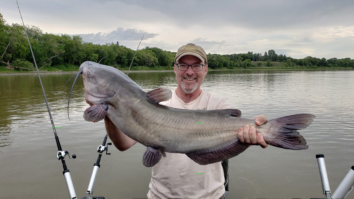 Hank with a huge catfish near Winnipeg in 2018. 