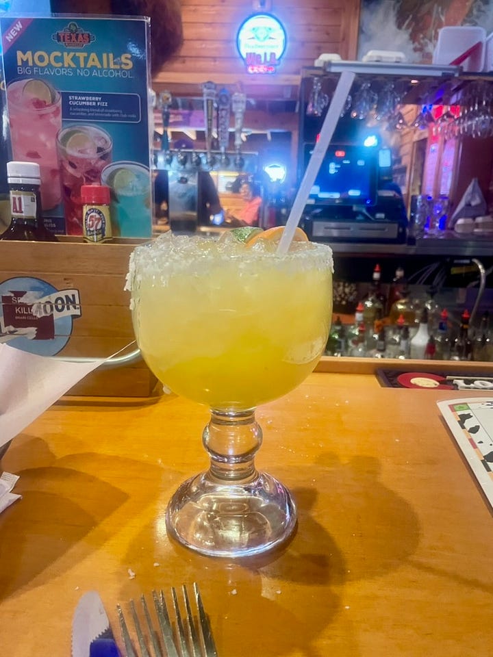 Photos of our tasty meals at the Texas Roadhouse. Filets, snake bite appetizer and a tasty margarita.