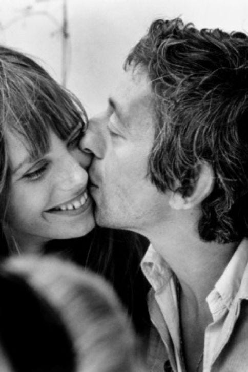Black-and-white photo of Jane Birkin smiling as Serge Gainsbourg kisses her cheek, taken in Normandie in 1969 by Tony Frank Black-and-white photo of Jane Birkin smiling as Serge Gainsbourg kisses her cheek, taken in Normandie in 1969 by Tony Frank