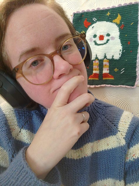 9 pictures of different fiber arts projects including a knit tapestry that says "Protect Trans Youth, a crochet tapestry of a wee ghost, a crochet blanket, a table runner, needle felted keychains, a butterfly cardigan for a little kid, and a blue and white striped cardigan for an adult.