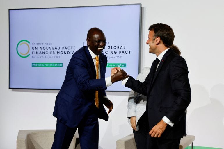 French President Emmanuel Macron and Kenyan President William Ruto shake hands as they take part in a round table to discuss global economy during the New Global Financial Pact Summit at the Palais Brongniart in Paris, France on June 22, 2023. Dozens of global leaders are gathering in Paris on June 22 for a summit to tease out a new consensus on international economic reforms to help debt-burdened developing countries face a growing onslaught of challenges, particularly climate change. LUDOVIC MARIN/Pool via REUTERS French President Emmanuel Macron and Kenyan President William Ruto shake hands as they take part in a round table to discuss global economy during the New Global Financial Pact Summit at the Palais Brongniart in Paris, France on June 22, 2023. Dozens of global leaders are gathering in Paris on June 22 for a summit to tease out a new consensus on international economic reforms to help debt-burdened developing countries face a growing onslaught of challenges, particularly climate change. LUDOVIC MARIN/Pool via REUTERS