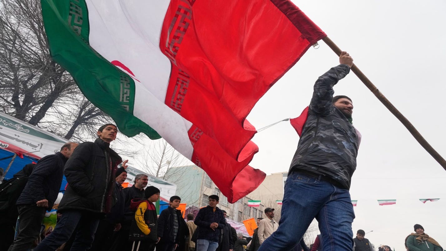 A person holding a flag
AI-generated content may be incorrect. A person holding a flag
AI-generated content may be incorrect.