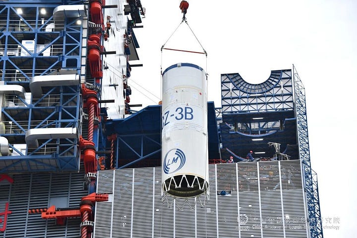 One of the Long March 3B/E's boosters and second-stage being lifted onto Launch Complex 3.