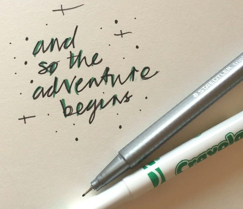 white and blue click pen on white paper