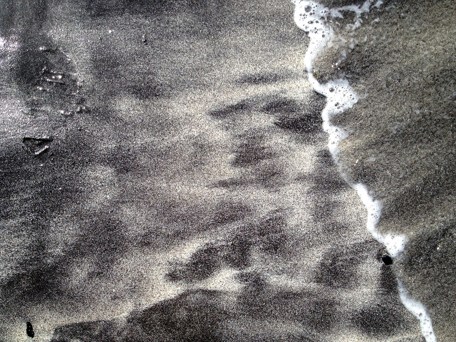 The black and white sands of Talisker Bay