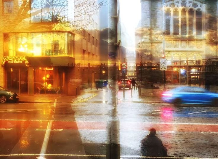 This may contain: a blurry image of a city street with cars and people walking on the sidewalk This may contain: a blurry image of a city street with cars and people walking on the sidewalk