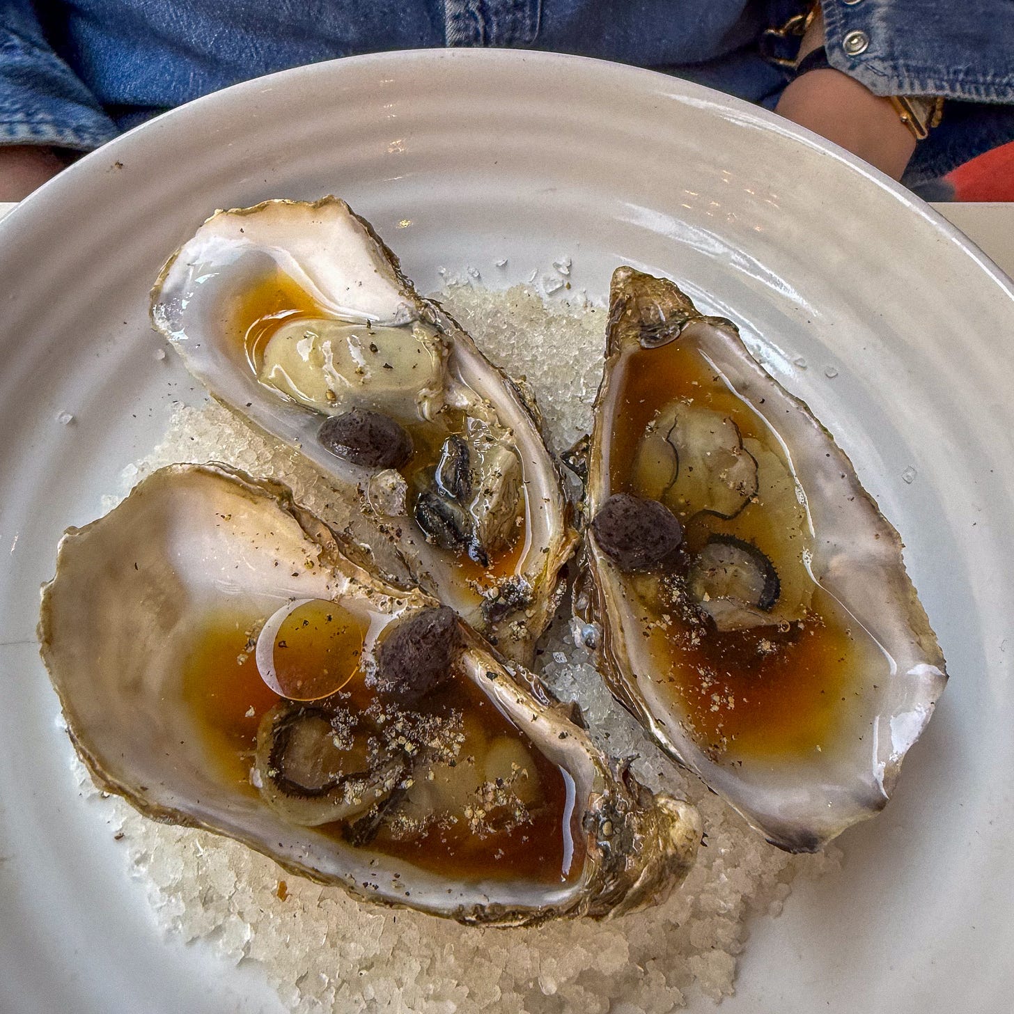 Oysters in dashi with toasted sesame oil and fermented black garlic at Argile, Paris 9th Oysters in dashi with toasted sesame oil and fermented black garlic at Argile, Paris 9th