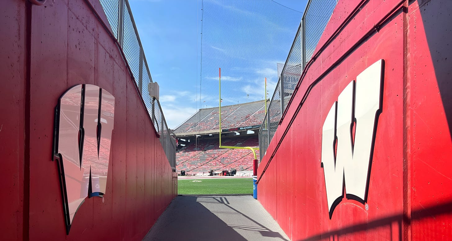 View from inside the Wisconsin Badgers tunnel at Camp Randall Stadium looking out onto the field.