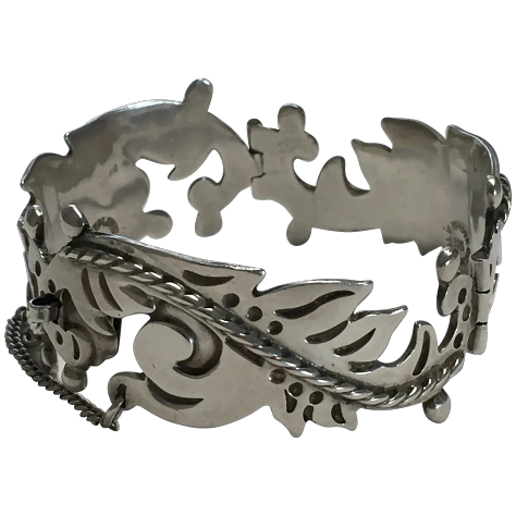 https://www.rubylane.com/item/2013583-ABG192/Taxco-Sterling-Floral-Motif-Link-Bracelet