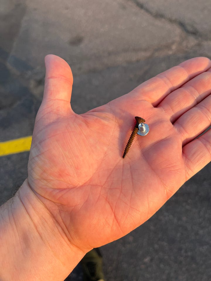 four images of things I've picked up off the ground in my walking. The first three are various screws and naisl. The last is an odd, heavy bit of round metal that appears to be a part from a car.