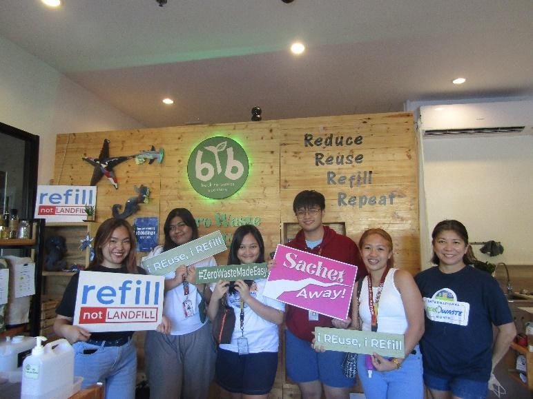 A group of people holding signs

Description automatically generated