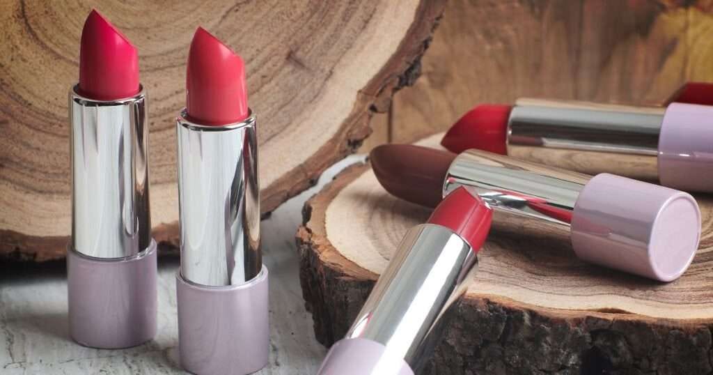 a group of lipsticks on a wood surface for a blog post called best lipstick colors for women over 60 a group of lipsticks on a wood surface for a blog post called best lipstick colors for women over 60