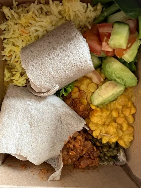 Chocolate Guinness Cake from Brunswick East, menu and box from vegan Ethiopian at Kaffa coffee in Dalston.
