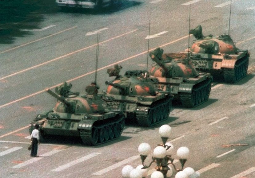 A group of military tanks on a street

AI-generated content may be incorrect.