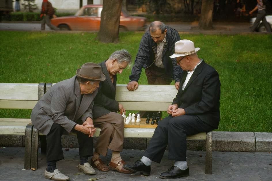 Chess players and casual spectators in a Lviv park. Chess players and casual spectators in a Lviv park.