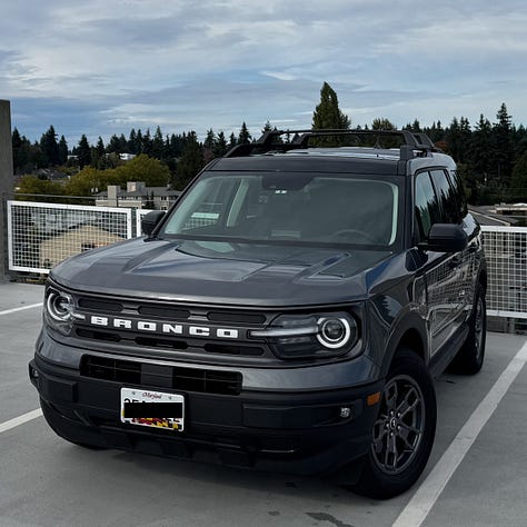 My car near Mt. Rushmore covered in dead bugs and the car wash that came next - and how the car looks now: cleaner.