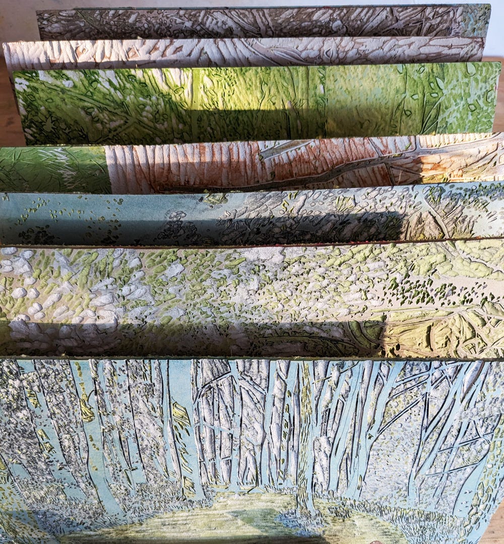 Carved lino blocks in bright sunlight, with strong shadows.
