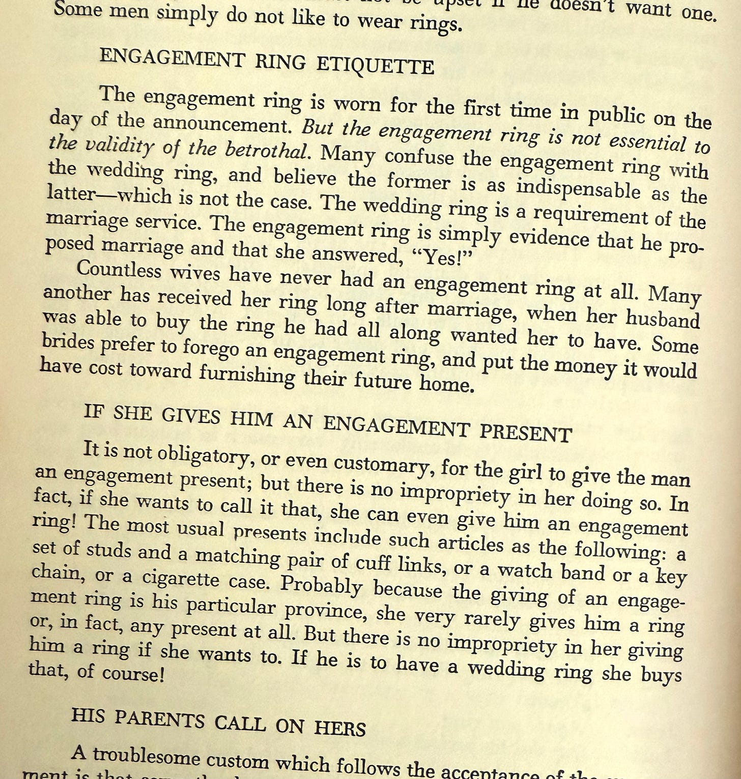 Picture of the 1960 edition of Emily Post's Etiquette opened to the page on Engagement Ring Etiquette and If She Gives Him An Engagement Ring
