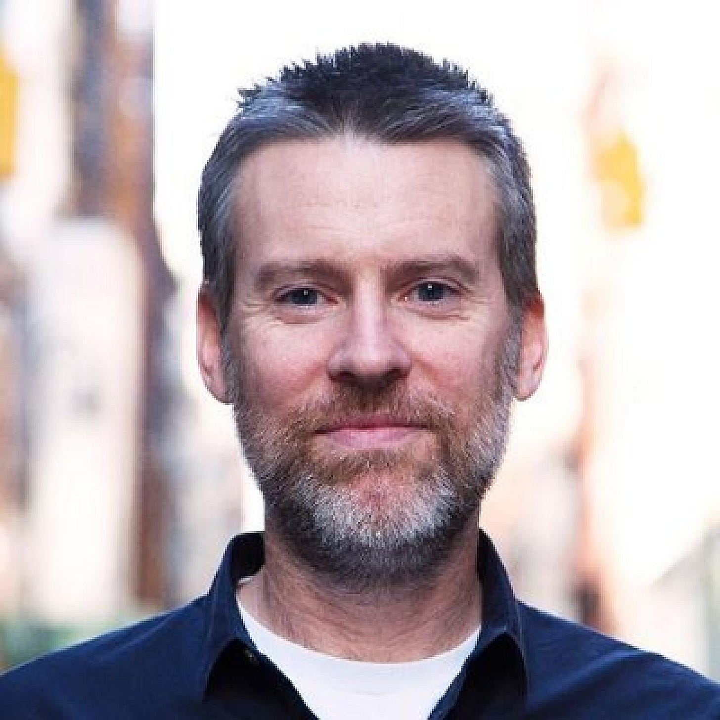 A headshot of Brian Morrissey with a blurred urban backdrop A headshot of Brian Morrissey with a blurred urban backdrop