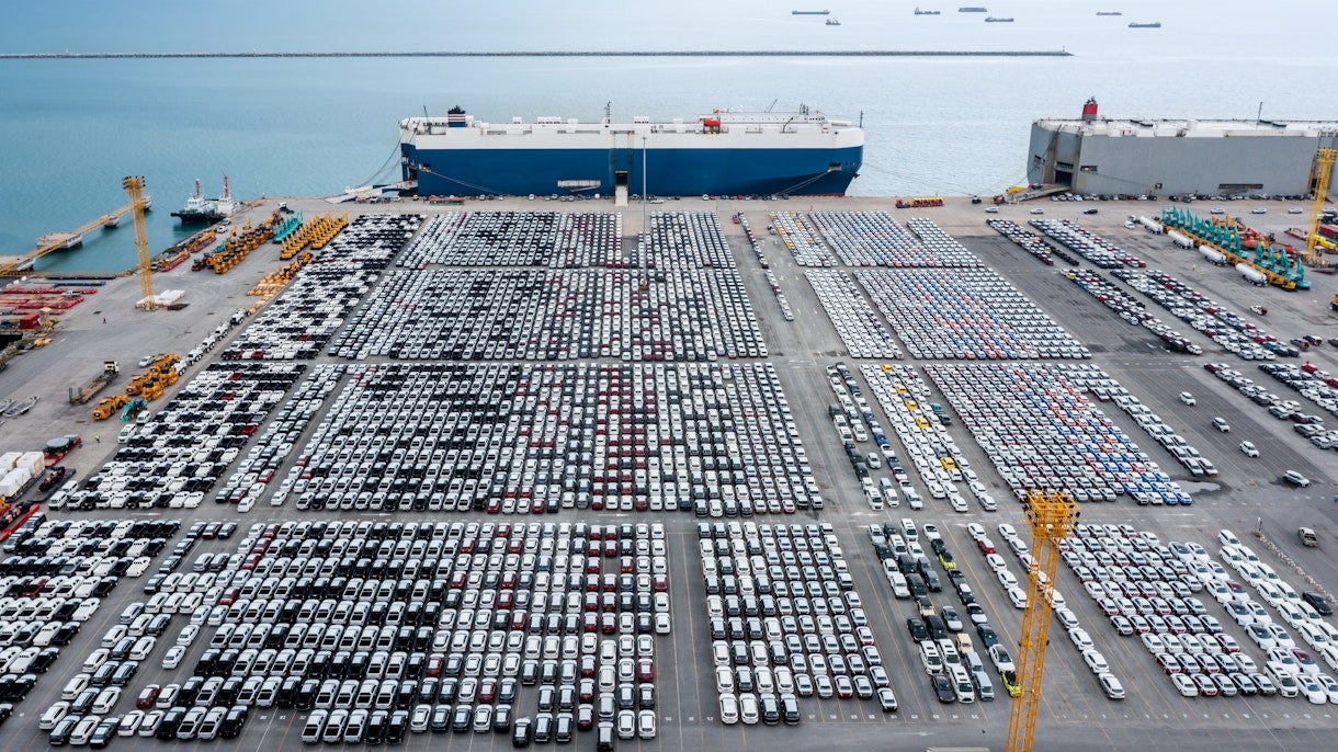 Photo depicts Large RoRo (Roll-on Roll-off) into Commercial dock loading new car product order for sale for export international on the sea, business service transportation concept, photograph Drone Point of view  Global EV Outlook 2026 GettyImages 147191