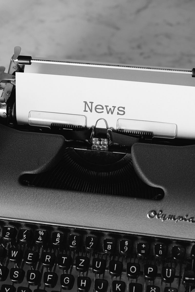A printer printing News text