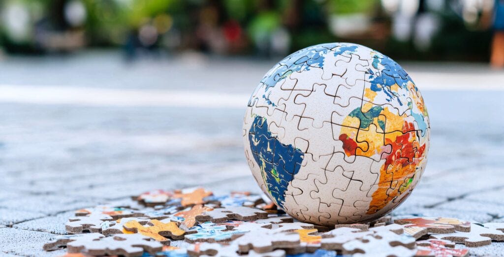 The current image has no alternative text. The file name is: vecteezy_globe-puzzle.jpg