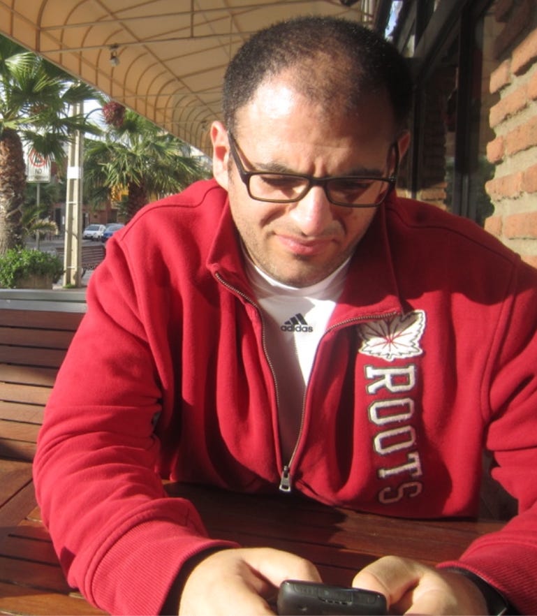 Me using a BlackBerry Q10 smartphone, a once-dominant mobile device that fell behind Apple and Android. A reminder of BlackBerry’s decline and how companies can be imprisoned by their own walls of complacency.