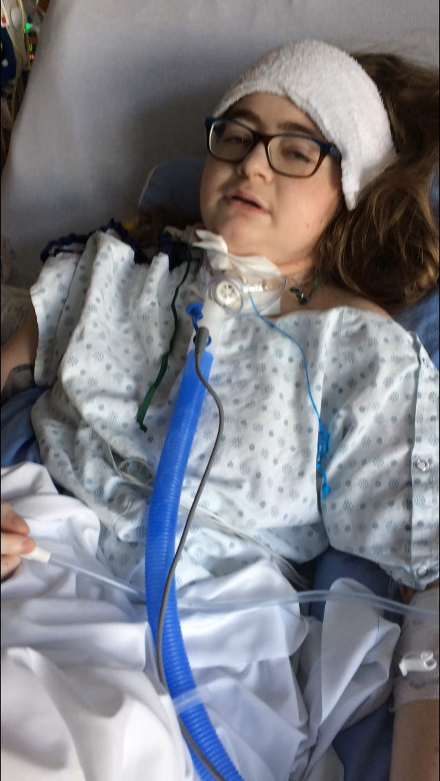 Me, a young woman, recovering in an ICU bed.