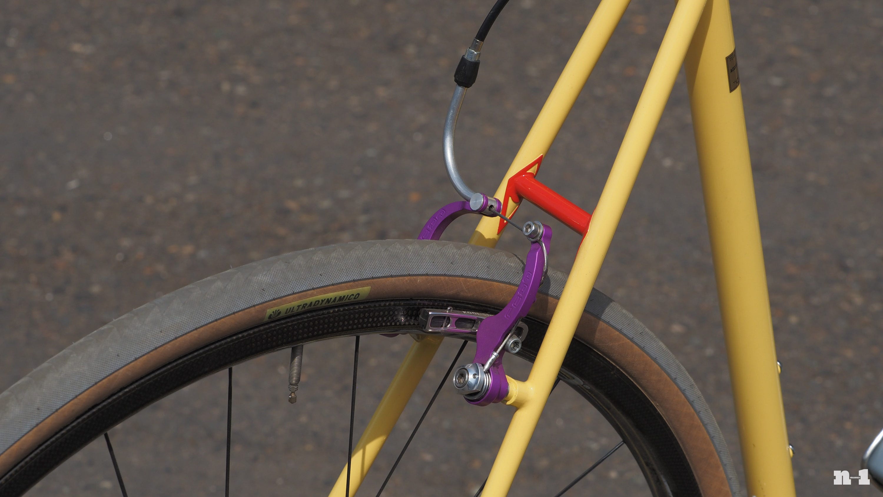 Marco Pedretti yellow road bike rear brake