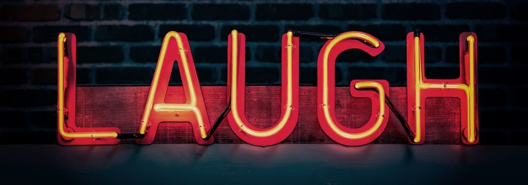 Laugh neon signage