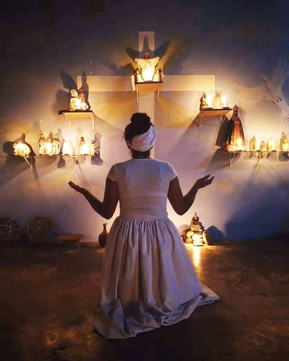 woman praying afrobrazilian religion candomble umbanda