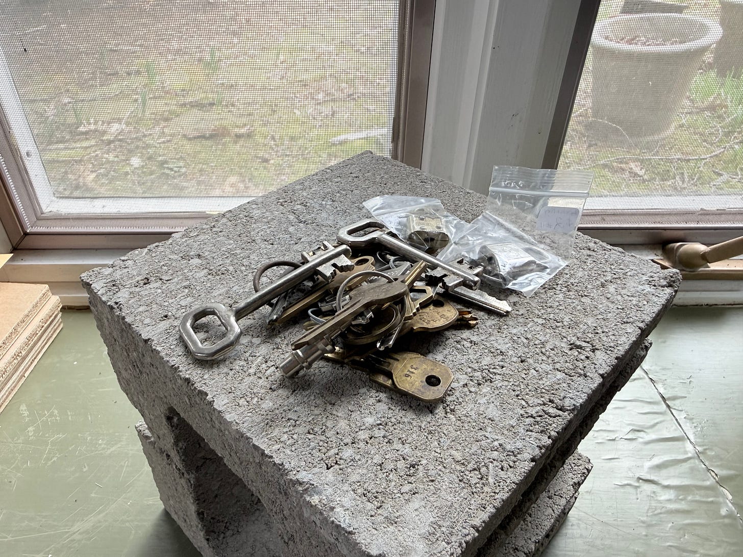 old keys on a cinder block old keys on a cinder block